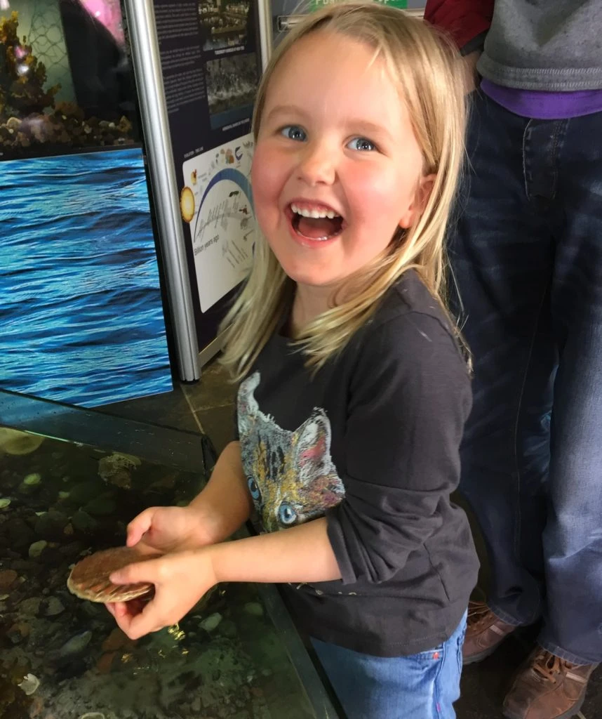 Ruby holding a crab